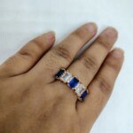 vibrant gold ring adorned with colorful gemstones,