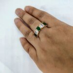 vibrant gold ring adorned with colorful gemstones,