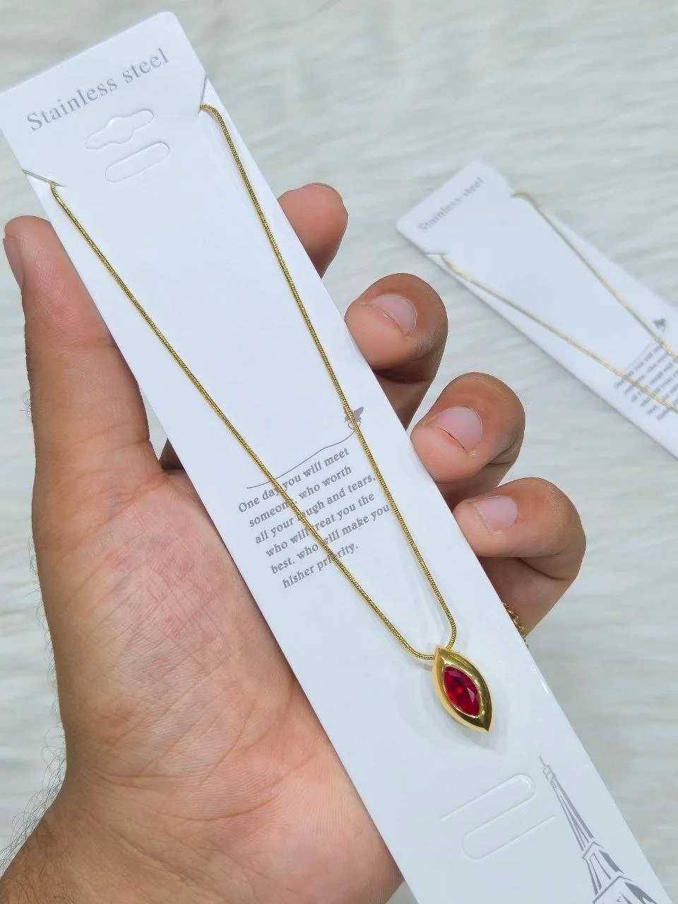 photo_6332180304835056827_y SS Stone Necklace for Women | Stainless Steel Bow & Heart Pendant Necklace | Elegant Gold-Tone Fashion Jewelry - Image 1
