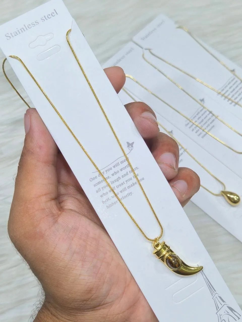 photo_6334546505397638548_y SS Stone Necklace for Women | Stainless Steel Bow & Heart Pendant Necklace | Elegant Gold-Tone Fashion Jewelry - Image 1